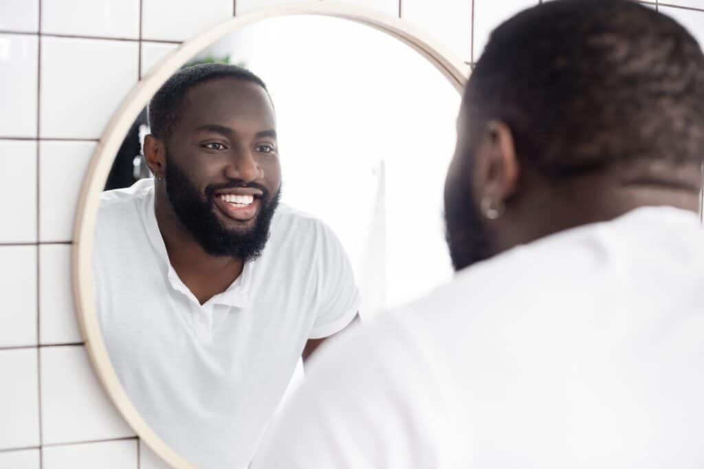 practicing talking and smiling in the mirror. Recovering from Dental Implant Surgery: Tips and Advice from Those Who’ve Been There.