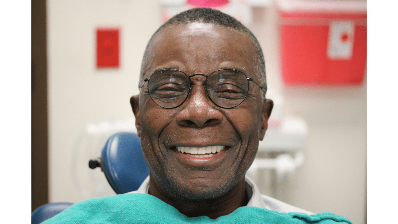 smiling man after new teeth now full mouth dental implants